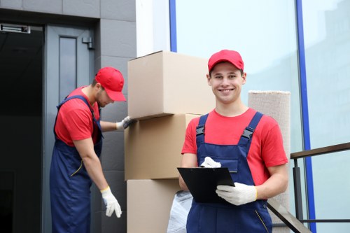 Furniture removals team planning a move in a Lambeth street