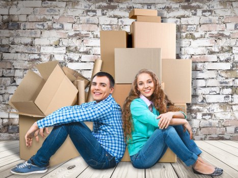 Removal van and moving team in a residential Lambeth street