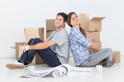 Careful stair carrying during a flat move in Lambeth