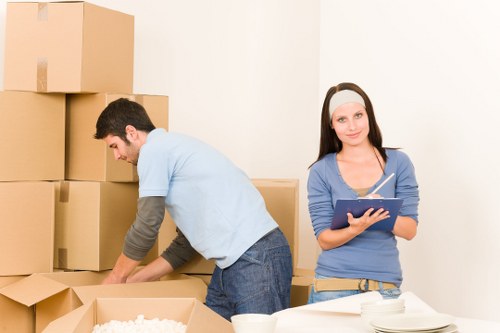 Worker using protective gloves while handling furniture