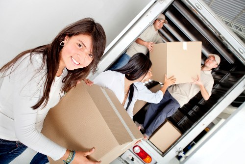 Team handling boxes and furniture for a flat move in Lambeth